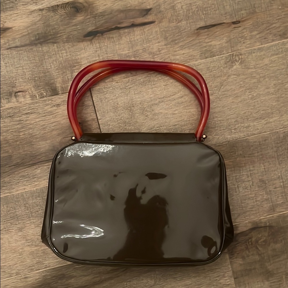 Elegant Black Handbag with Red Handles